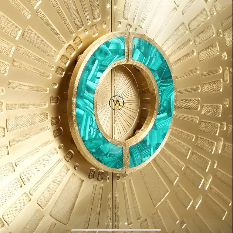 Close-up of luxury brass cabinet with turquoise malachite handle in sunburst pattern