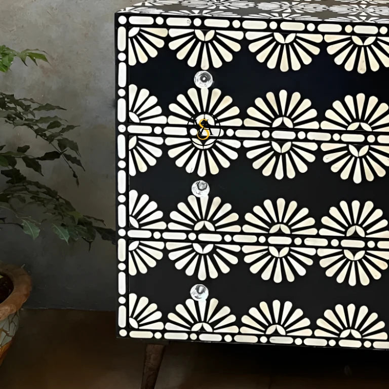 Close-up view of the black bone inlay chest with floral design showing intricate hand-crafted details and crystal knobs