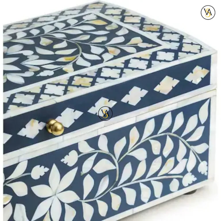 Close-up view of blue bone inlay jewelry box with floral detailing