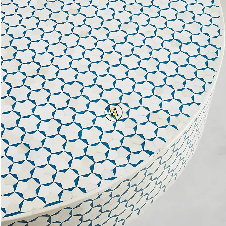 Close-up of bone inlay craftsmanship on coffee table surface