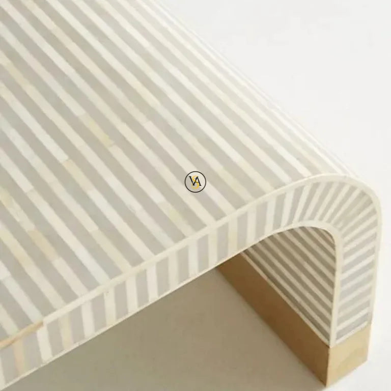 Close-up of Bone Inlay Detailing and Brass Base on Waterfall Coffee Table with brand logo