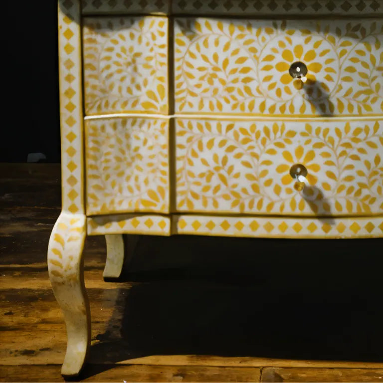 Detailed leg and drawer view of yellow bone inlay console on wooden floor
