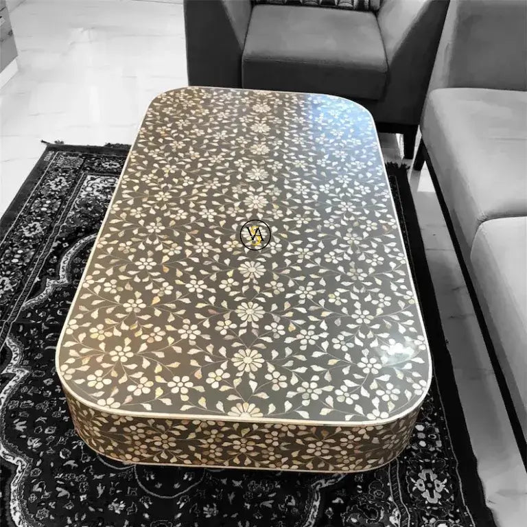 closeup.webp
Close-up view of Luxury Mother of Pearl Inlay Coffee Table with brass base