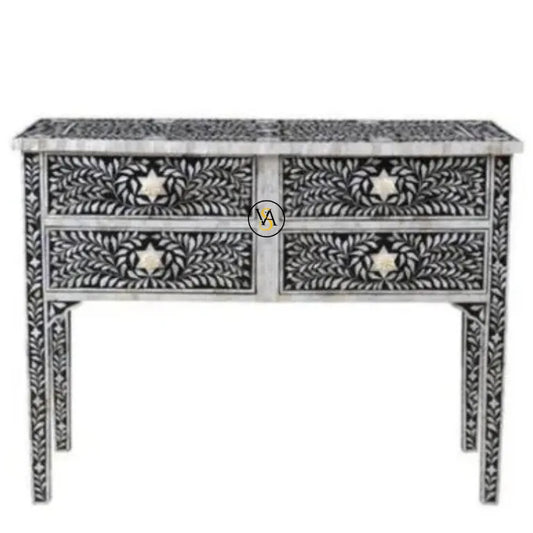 Decorative console table with intricate black and white patterns on a white background