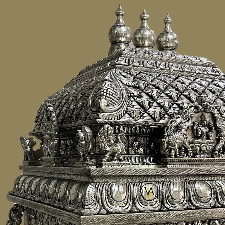 Ornate temple dome featuring Goddess Laxmi, elephants, and fine silver detailing.