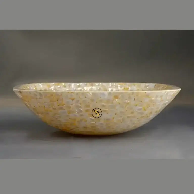 Decorative basin with a speckled pattern on a gray background
