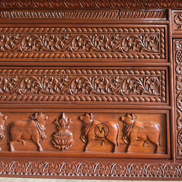 Cow and kalash carving on bottom panel of mandir