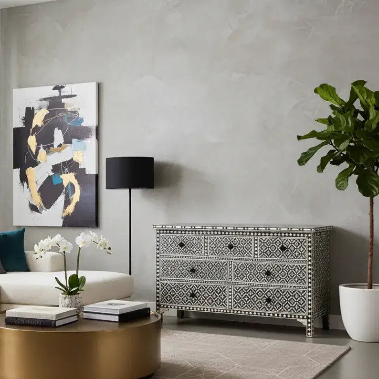 Modern Living room with a Bone Inlay Black Chest of 7 Drawers, coffee table, and abstract art on a gray wall.