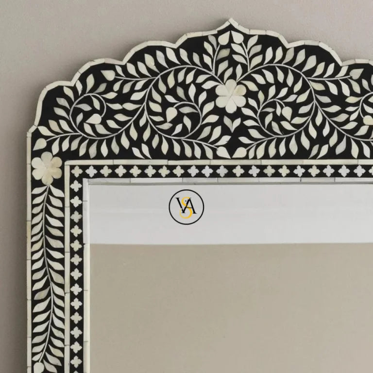 Bone Inlay Mirror with black and white floral pattern on a plain background