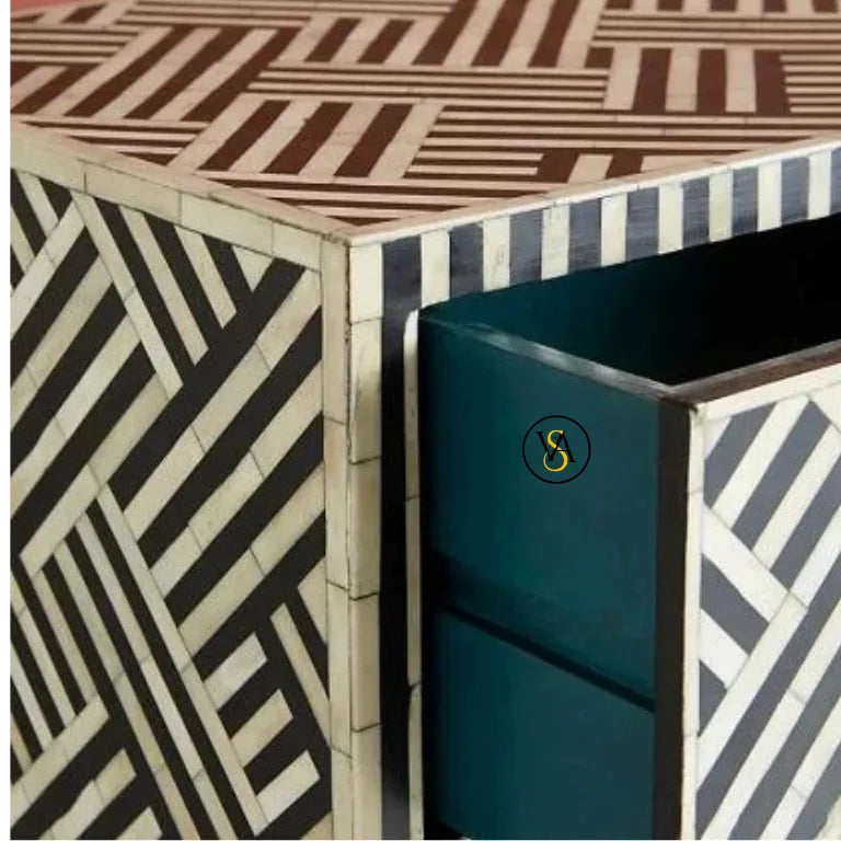 Geometric dresser surface with a teal object featuring a logo.