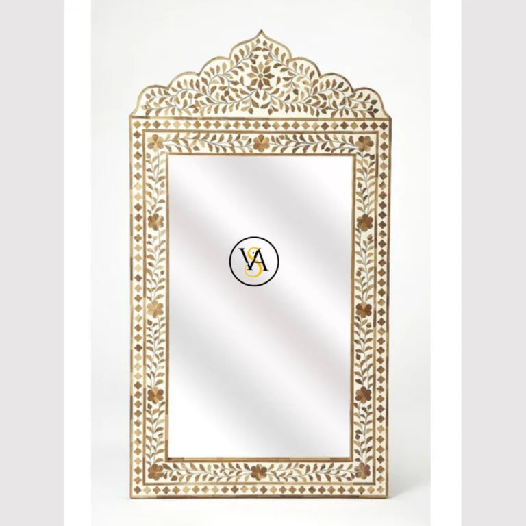 Decorative brown wall mirror with intricate gold frame on a white background