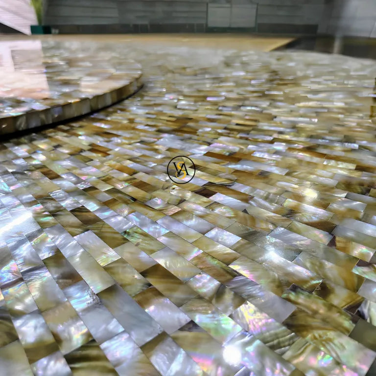 Close-up of shimmering sunburst design – Golden Mother of Pearl Dinner Table