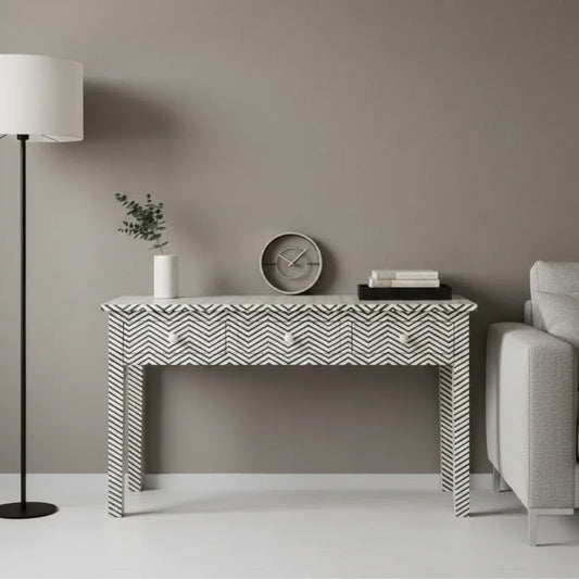 Handmade Bone Inlay 3 Drawer Black Console with Chevron Design front view in black and white finish with decorative items in a living room setting