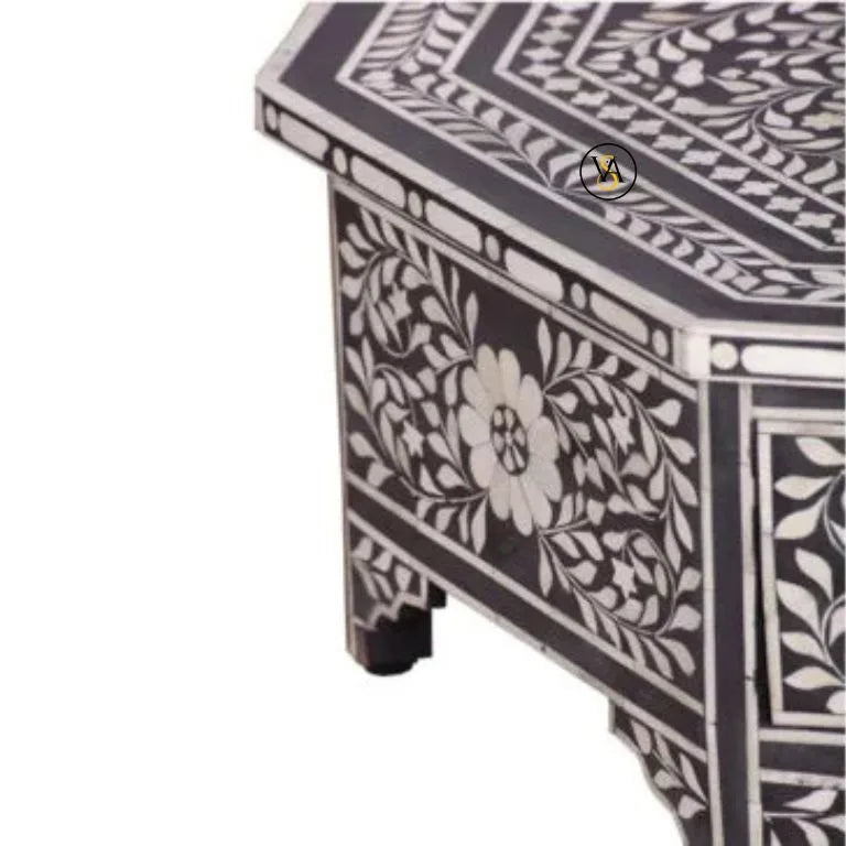 Decorative coffee table with intricate black and white pattern on a white background