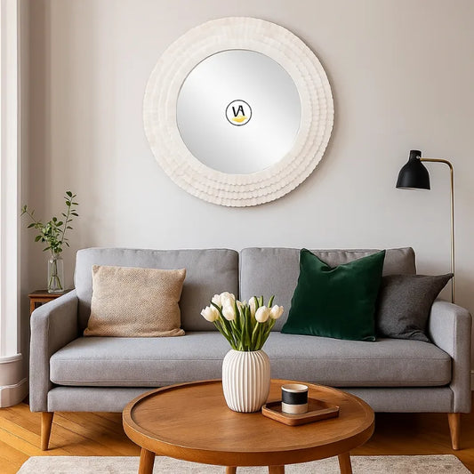 Handmade Bone Inlay Round Wall Mirror in white for living room with a gray sofa, wooden coffee table, and decorative pot & flower.
