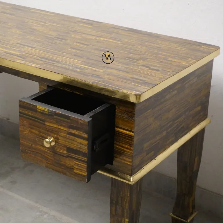 Mother of pearl desk with a single drawer open, showing a brand logo on the surface.