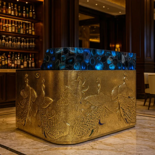 Luxury Peacock Bar Cabinet in hotel bar setting with glowing blue Agate top