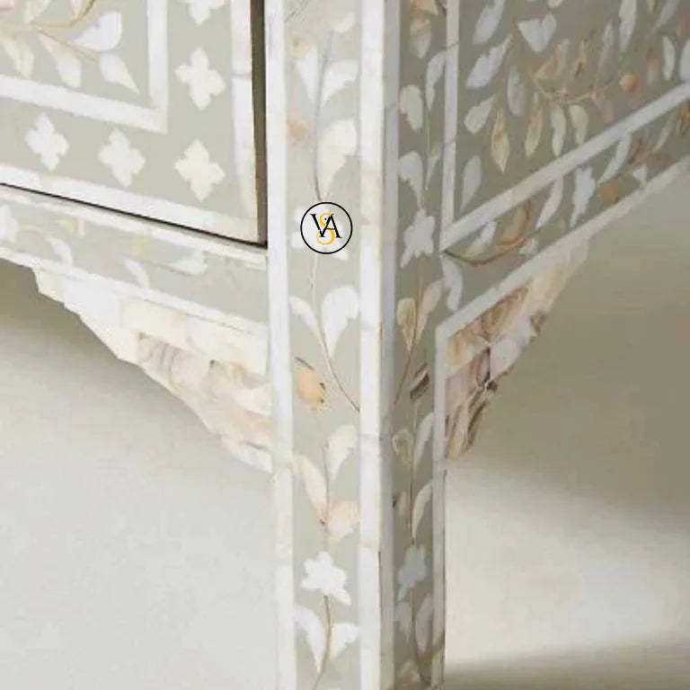 Decorative sideboard with intricate cut-out patterns on a neutral background