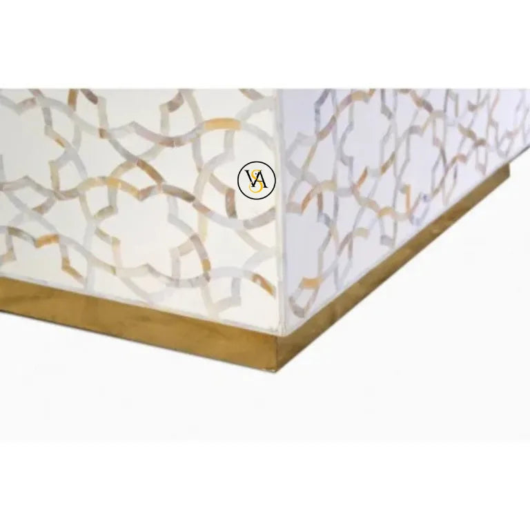 Close-up of a decorative coffee table with a mother of pearl inlay design.
