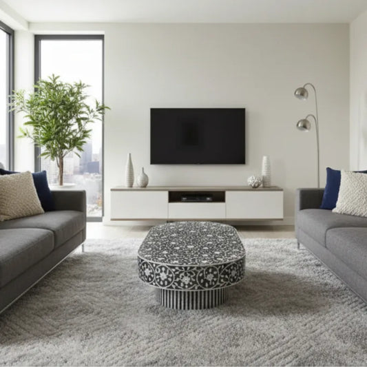Handcrafted Mother of Pearl Gray Coffee Table with Star Floral Pattern in modern living room with a gray sofa, and Led Tv on a light beige wall.