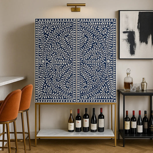Front view of navy blue floral bone inlay bar cabinet with brass legs and wine bottles displayed