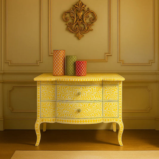 Yellow floral bone inlay chest of drawers with ornate wall decor and vases