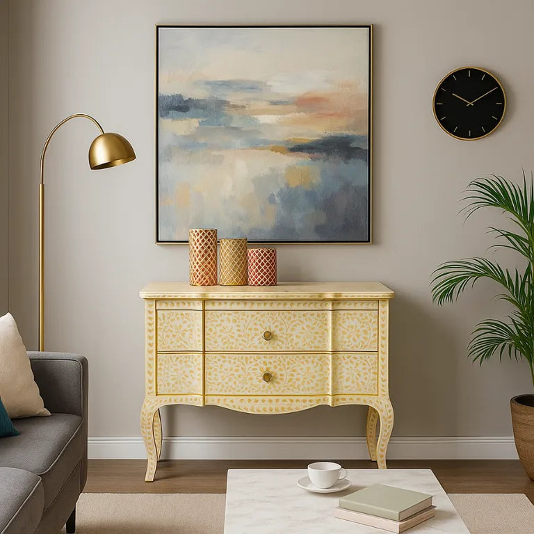 Living room with a bone inlay chest of drawers, lamp, and wall art.